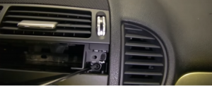 Remove two screws holding the radio with a screwdriver