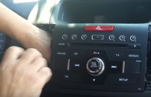 Remove screws that fixed the radio on the dashboard