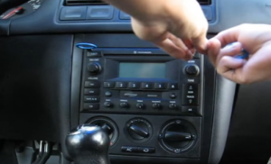 There are four removal slots in this radio. Insert the removal keys in the holes of the radio
