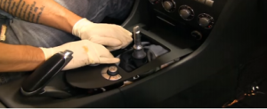 Remove the trim panel under the brake with your hands