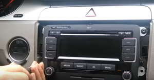Use a screwdriver to remove four mounting screws of the radio