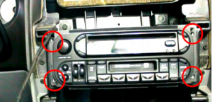 Remove 4 screws which holds the factory radio in place