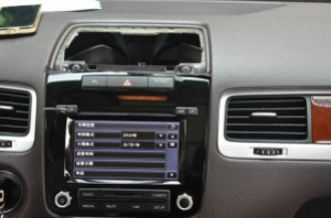 Remove the panel above the original car radio