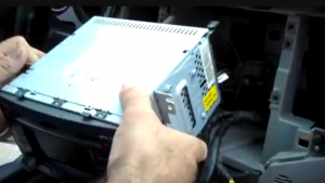 Gently remove the original radio from the dash