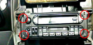 Remove 4 screws which hold the factory radio in place