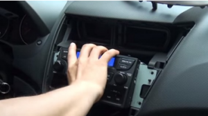 Take the original radio out of the dash with your hands