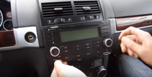 Remove the original radio with the unlock tools
