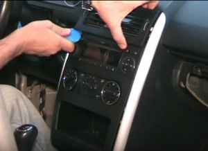 Remove the air vent with a plastic removal tool and then put it aside