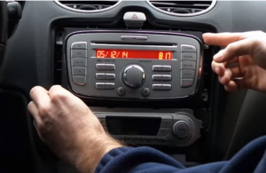 Gently take the original car radio out of the dashboard