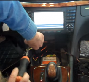 Remove two screws that fixed the original radio on the dashboard