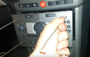 Take the original car radio out of the dashboard by pulling the removal sticks