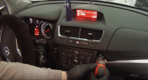 Use a screwdriver to remove four screws that are fixing the radio panel