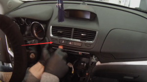 Use the plastic removal tool to pry up the air vent and remove the connector at the back so as to get access to the screen
