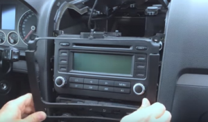 Remove the panel on the original car radio