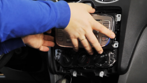 Gently remove the original car radio out of the dash