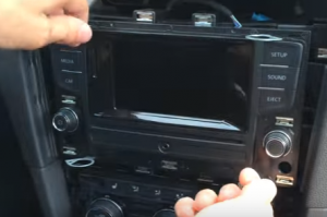 Insert four release keys in the removal slots of the radio and pull outwards to release the radio
