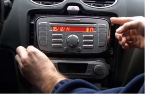 Gently take the original car radio out of the dashboard