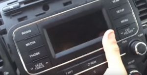 Take the factory radio out of the dash with your hands