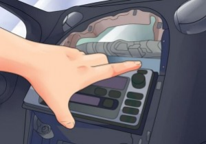 Pull the factory radio out of the dash. Pull it with medium force, as the wires are connected to the radio