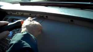 Use a screwdriver to remove the three screws that fix the panel around the original car radio