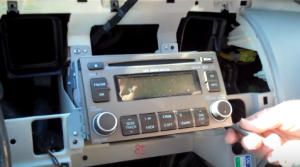 Remove screws that are holding the original car radio