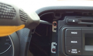 Remove four screws that fixed the radio on the dashboard