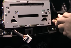 Remove four screws that are holding the radio