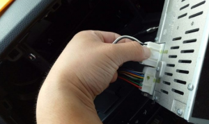 Disconnect the connectors and cables at the back of the radio