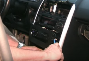 Remove the trim panel with a plastic removal tool