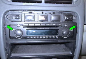 Remove 2 screws holding the stereo in the dashboard frame (green arrows). Please note that there will be four screws in the cars with navigation