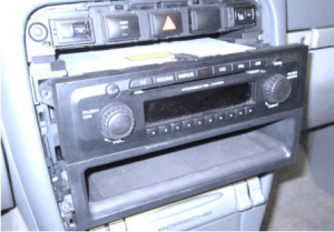 Carefully take the factory stereo out of the dash. When removing the factory radio, please note that there are two locking tabs on the lower tray that can break easily