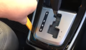 Remove the trim panel surround the car radio with a plastic knife