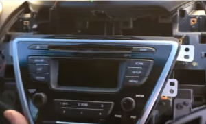 Gently pull out the original car radio. Then unplug the connectors at the back of the factory radio