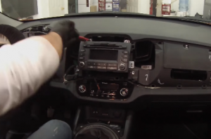 Remove four screws that are holding the radio on the dashboard