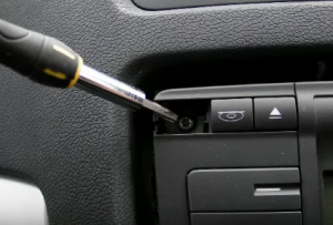 Remove four screws that fixed the radio on the dashboard