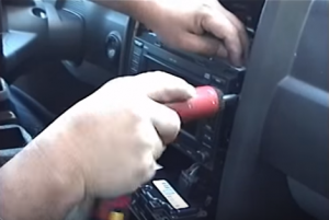 Remove four screws that fixed the radio on the dashboard