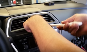 Remove the air vent with a plastic removal tool