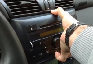 Softly pull outwards to release the car radio