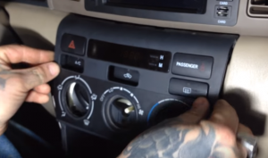 Place the panel to the original place and fix the screw. And put the shifter back, make sure the connector is connected back as well
