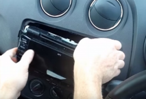 Take the factory radio out of the dashboard