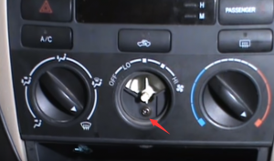 Remove the center button for the heater control panel