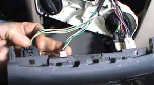 Disconnect the connectors at the back of the heater control panel