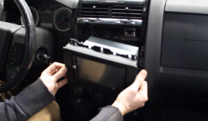 Gently pull the original car radio out from the original car radio