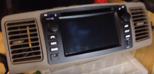 Make the new car stereo clip into the original air vent