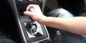 Remove the shift knob by screwing it off counterclockwise