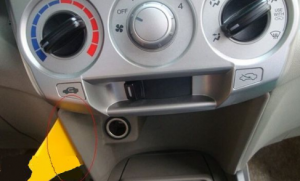 Remove screw below the radio and then pry the panel with a plastic removal tool