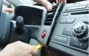 Remove the automotive oil table top panel with plastic knife