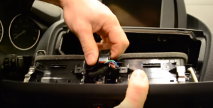Unplug the connectors at the back of the air vent
